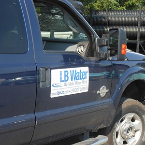 Close-up of passenger door displaying LB water logo on truck